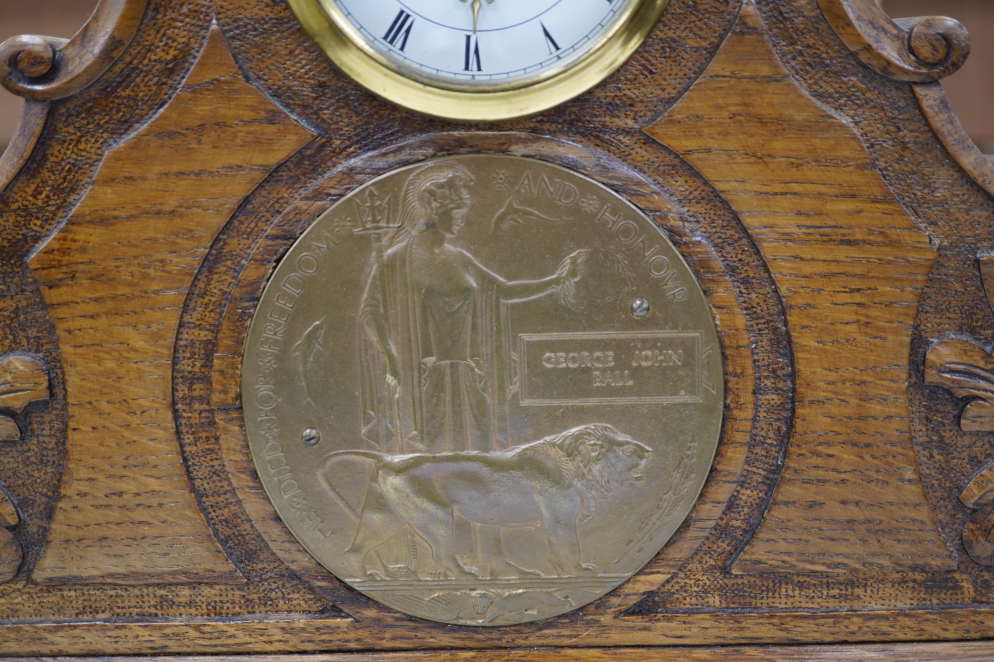 A First World War medal trio awarded to Pte. J. Ball Oxf. & Bucks. L.I., together with an oak mantle clock inset with a memorial plaque awarded to George John Ball, plus related paperwork. Condition - fair to good